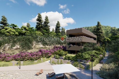 An apartment for sale on Korcula, Croatia, in a modern building with terraces, surrounded by pathways and nature.