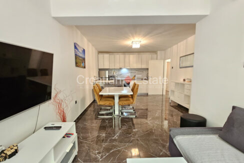 A flat for sale in Marjan, Split, Croatia, with an open-plan room consisting of a living area, a dining area, and a kitchen.